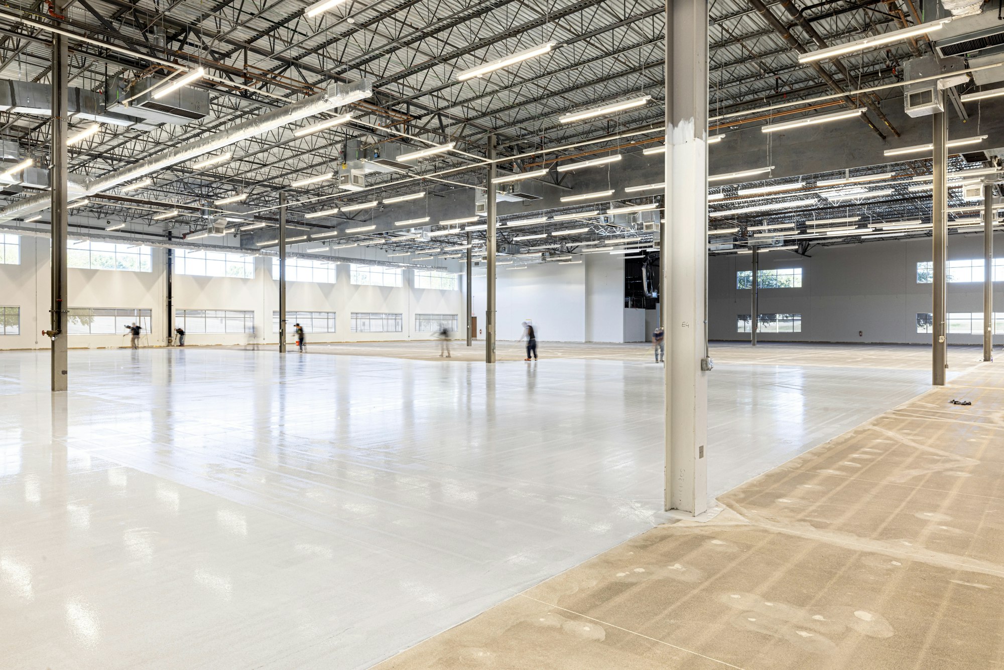 Crew coating a large epoxy floor